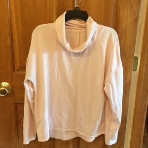 A light pink athletic sweatshirt